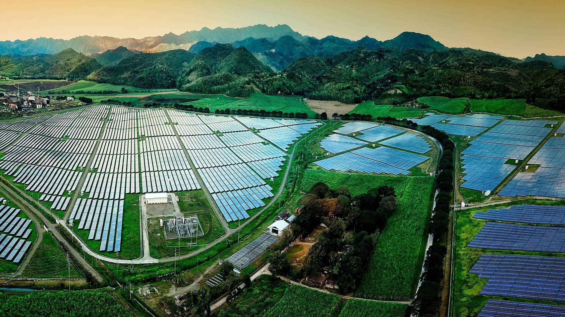 A solar farm in a luscious valley