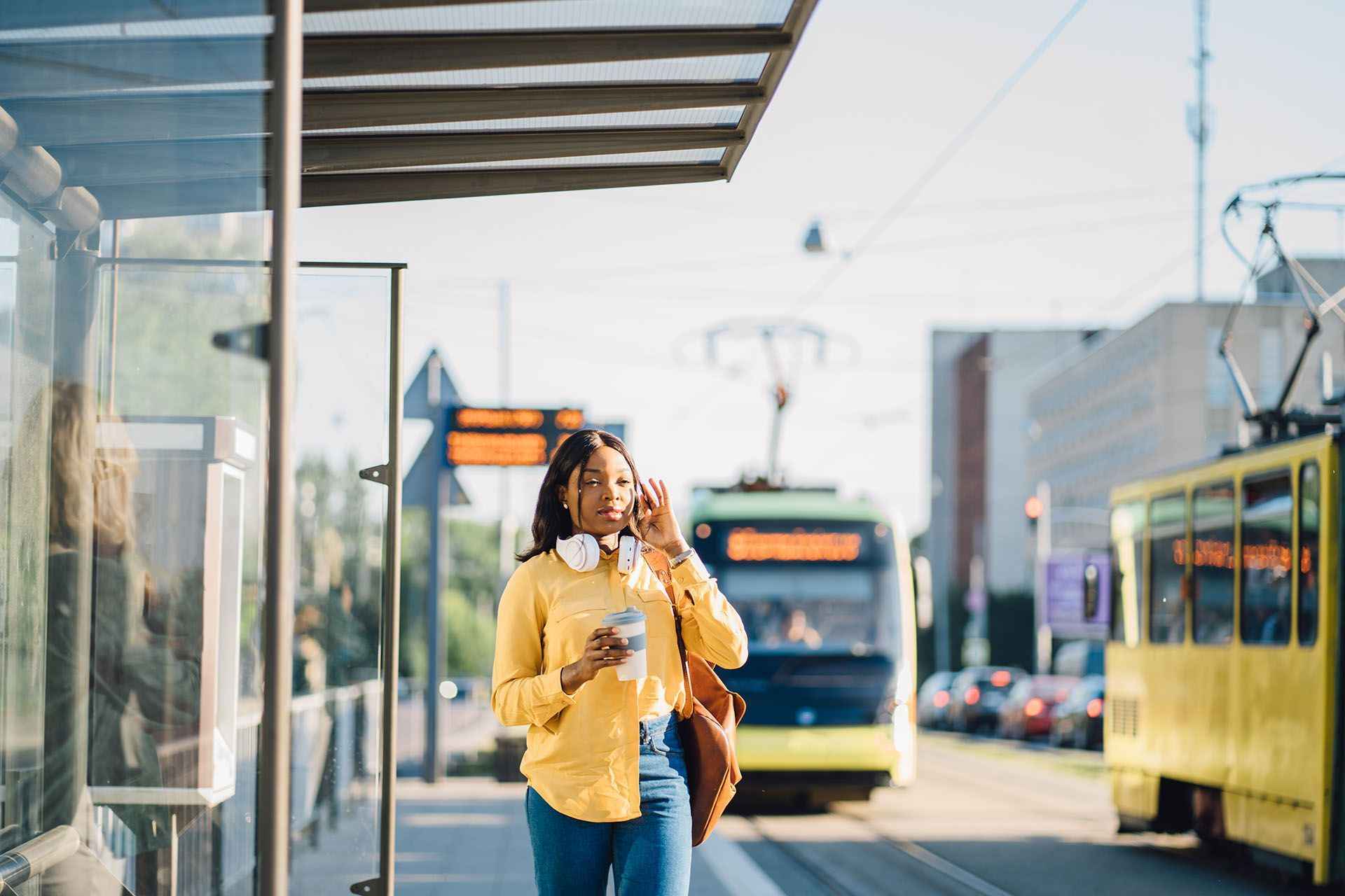a woman at a tram stop